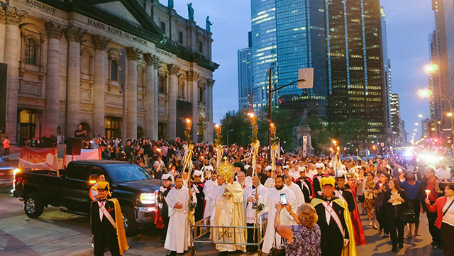 Hundreds of people in procession for Corpus Christi