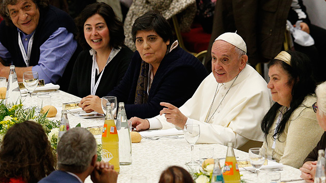 Pope Francis eats lunch with the poor in the Paul VI hall after celebrating Mass marking the first World Day of the Poor at the Vatican Nov. 19. Some 1,200 poor people joined the pope for the meal.