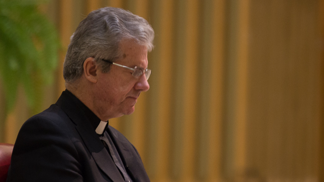 Archbishop Christian Lépine praying