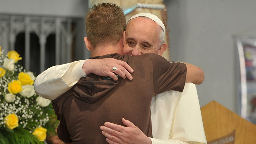 Pope Francis welcome a young person 