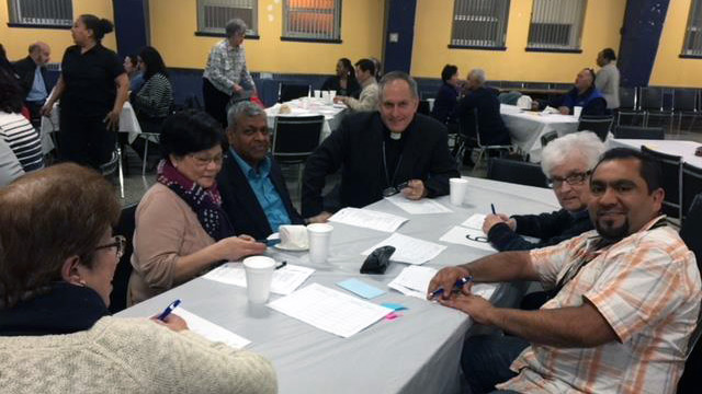 Bishop Alain Faubert with different members of cultural communities in Montreal.
