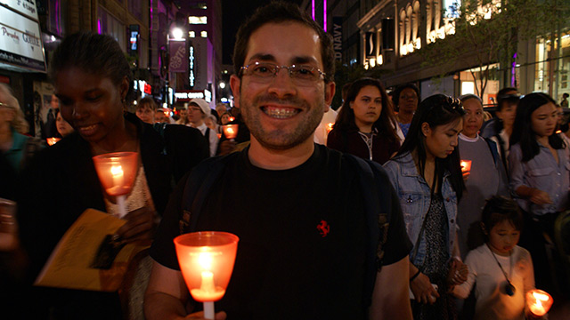 José, arrived from Colombia 2 months ago and participating in the procession with joy! &#40;Photo: Brigitte Bédard&#41;