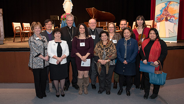 Archbishop Christian Lépine with the people in charge of the event. (Photo: Santino Matrundola)