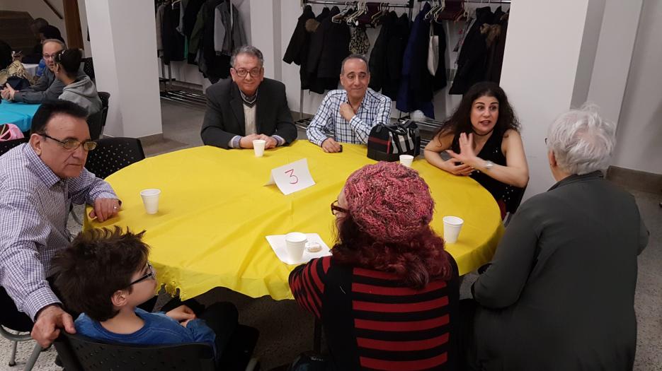 A refugee family discussing.