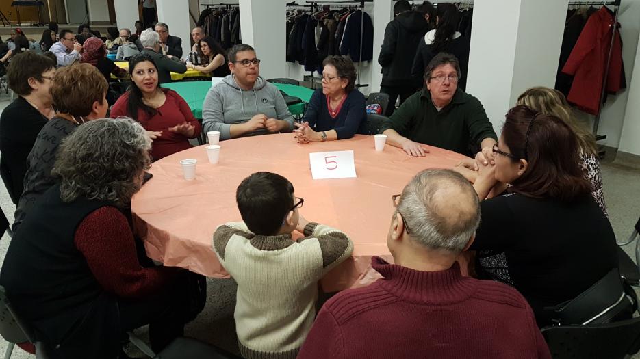 A refugee family discussing.