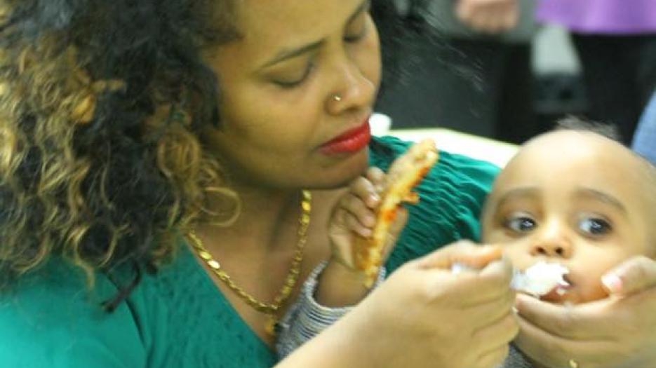 A mother with her child.