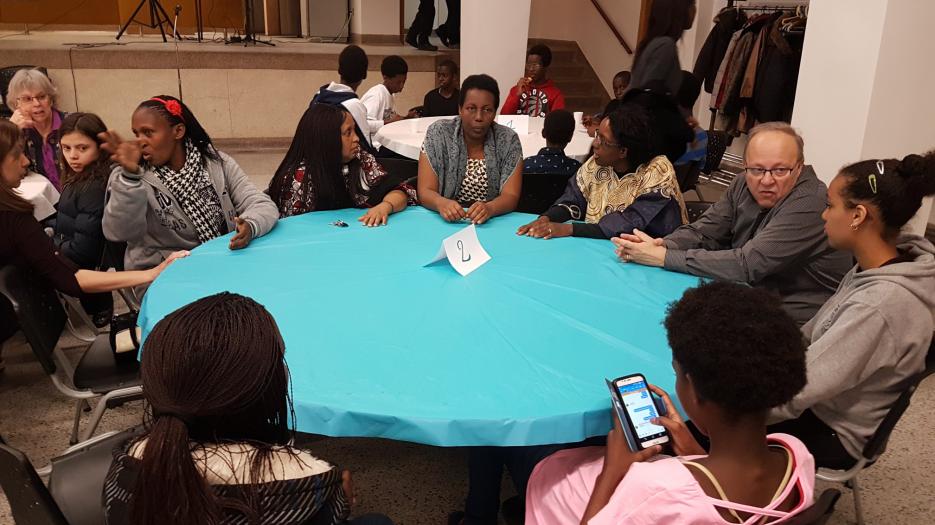 A refugee family discussing.