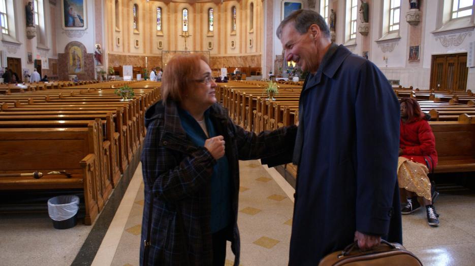 Bishop Michel Parent, proudly baptised and celebrated his first masse in 1967 here, is reunited with a parishioner. (Photo: Brigitte Bédard)