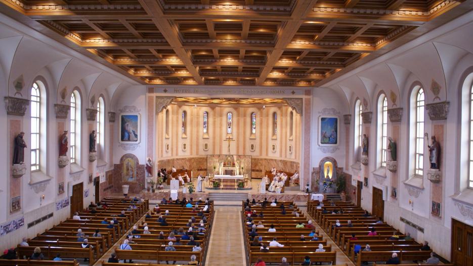 Balcony view, where we could see the chamber celling. In the 90s, major work, undertake by priest Robert Paradis, was done on the church to give it a sheen effect.  Fresh colors were applied to the church statuary; the Notre-Dame-de-Lourdes statue on the right new placement elevated her beauty and favors prayer. (Photo: Brigitte Bédard)