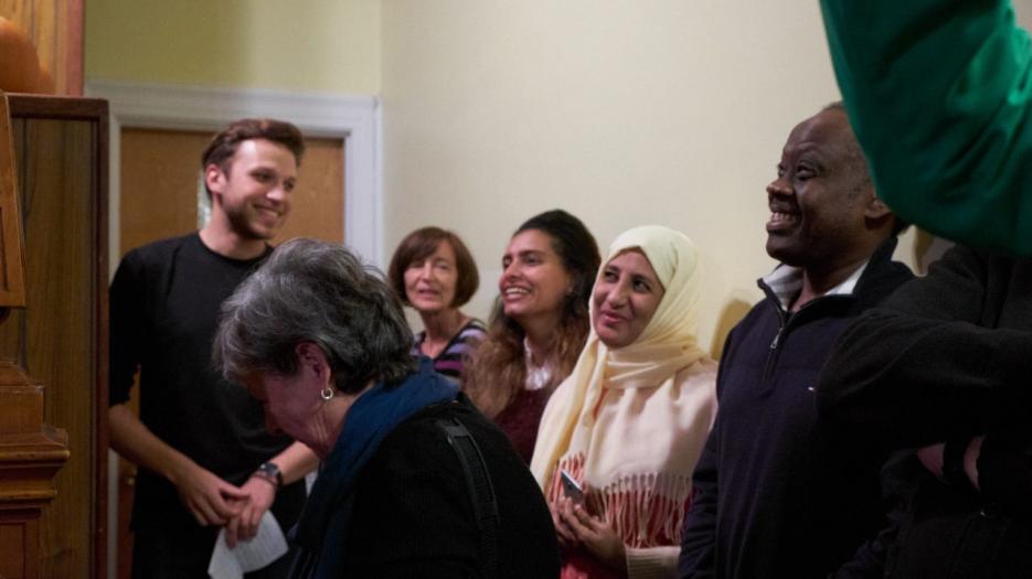 Arthur and other volunteers with an Egyptian family. (Photo: Richard Maltais)