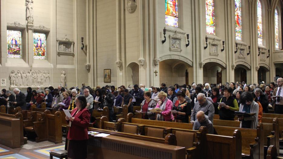 The assembly during the Gospel reading.