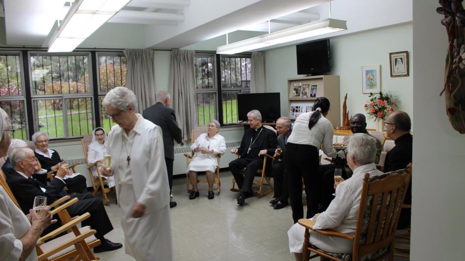 Before the meal, Msgr. Lépine met with sisters who, for health reasons, were not able to attend the celebration and shared a small bite with the others.