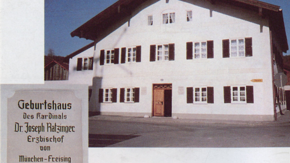 The house where he was born and the plaque which recalls that Cardinal Dr. Joseph Ratzinger was born here on April 16, 1927, Archbishop of Munich and Freising